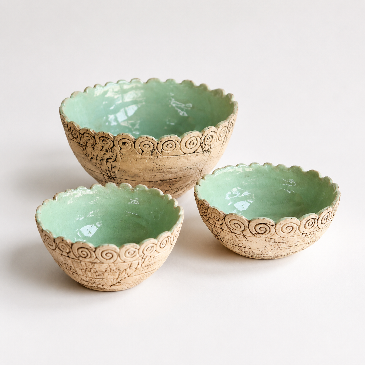Handcrafted Mint Green Ceramic Bowls photographed on a warm beige studio background