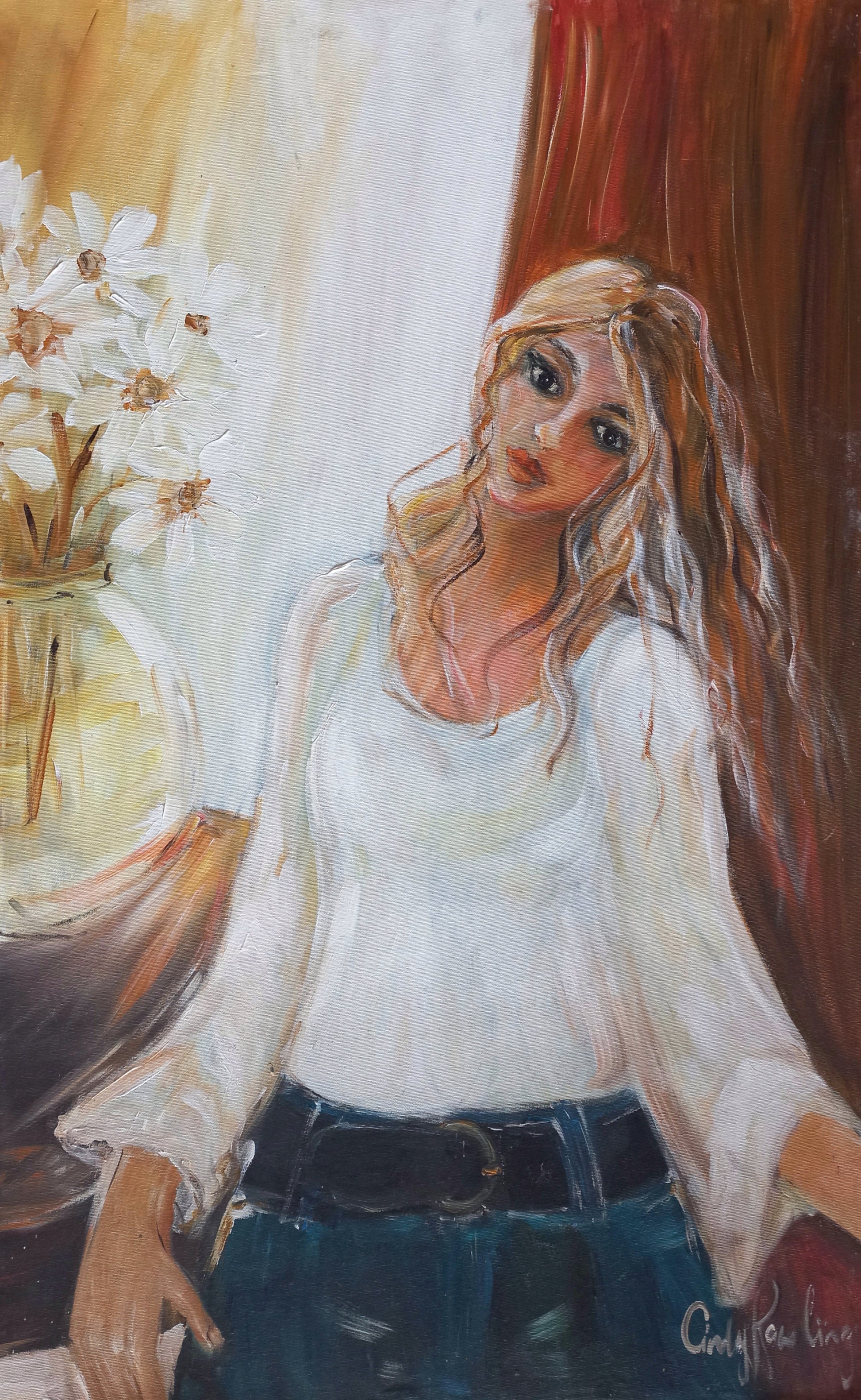 Oil painting of a woman in a white top and jeans, seated casually beside a vase of white daisies, bathed in warm, natural light.