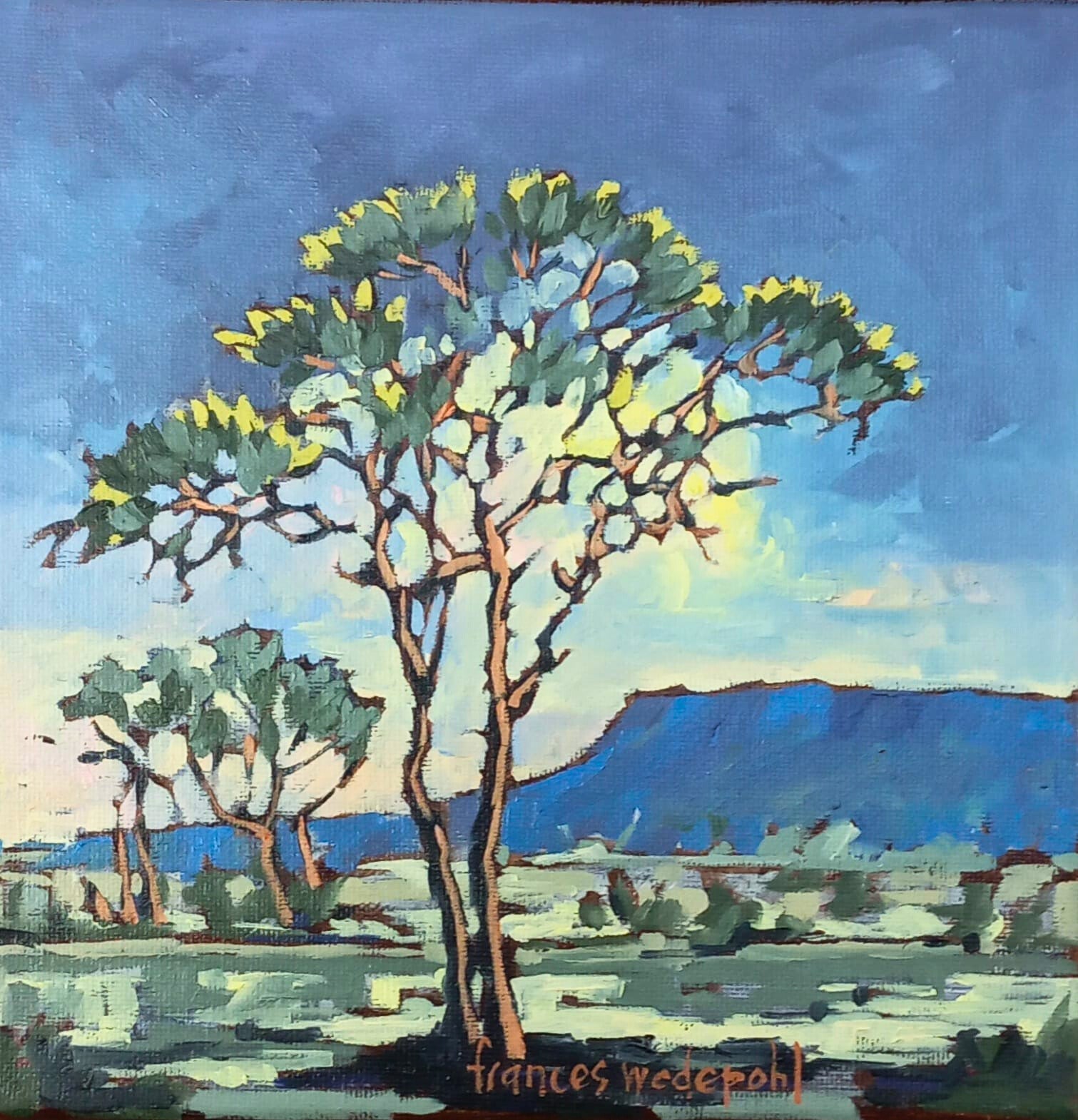 Oil painting of a tree with green and yellow leaves framing distant blue mountains under a soft blue sky.