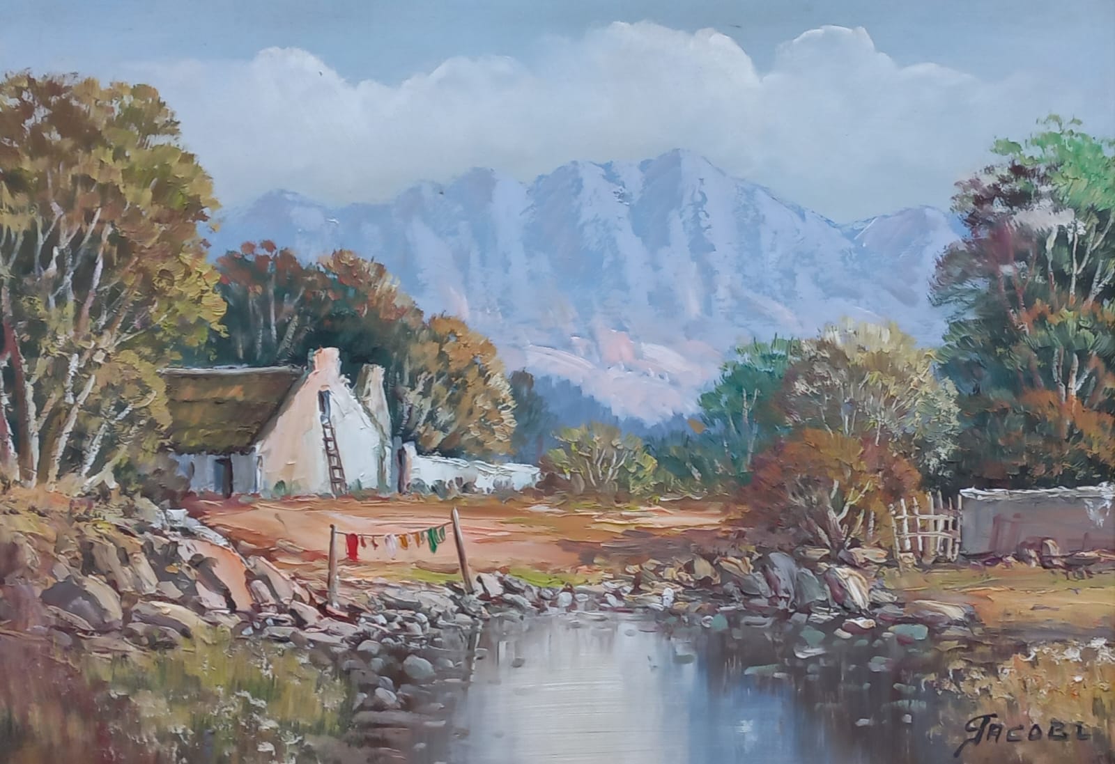 Oil painting of a white cottage beside a river with laundry hanging on a line, mountains in the background under a soft blue sky.