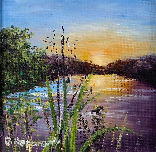 Oil painting of a marsh at sunset with reeds in the foreground and reflective water under an amber sky.