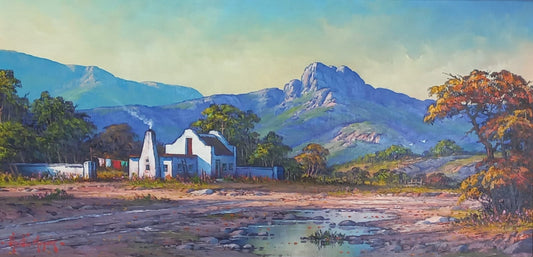 Oil painting of a white cottage beside a river with laundry hanging on a line, mountains in the background under a bright blue sky.