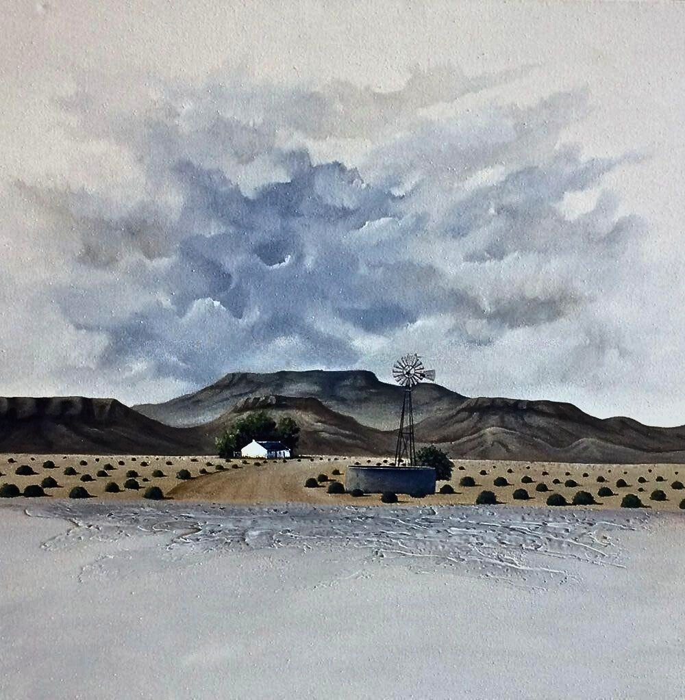 Mixed media painting of a white cottage and windmill on an arid plain, with distant hills and a cloudy sky.