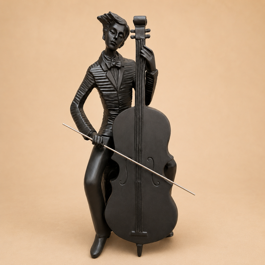 Black Cellist Musician Sculpture photographed on a warm beige studio background