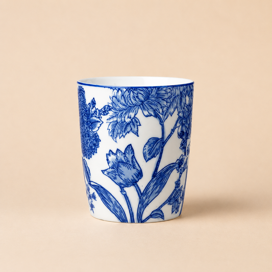 Blue and White Botanical Ceramic Vase photographed on a warm beige studio background