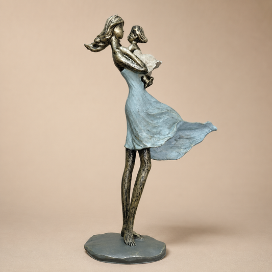 Blue Mother and Child Standing Sculpture photographed on a warm beige studio background