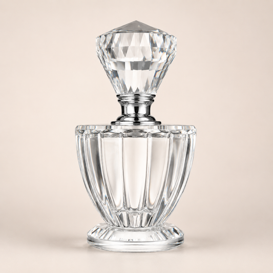 Clear Crystal Perfume Bottle photographed on a warm beige studio background
