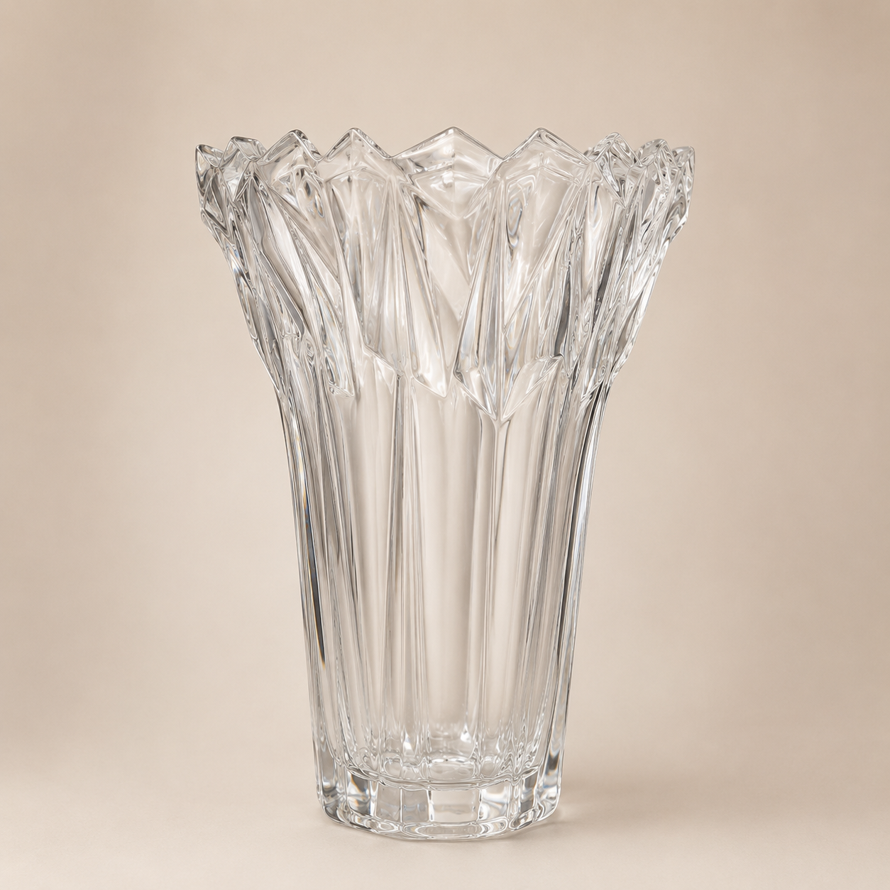 Clear Ribbed Crystal Vase photographed on a warm beige studio background