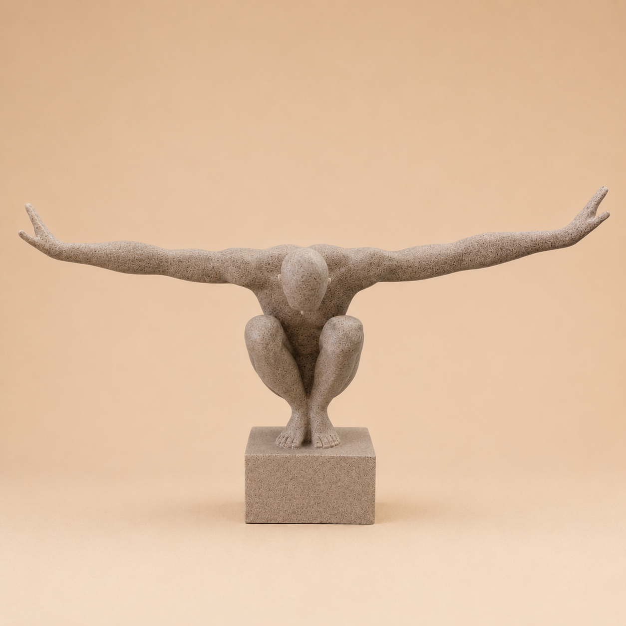 Crouching Balance Figure Sculpture photographed on a warm beige studio background