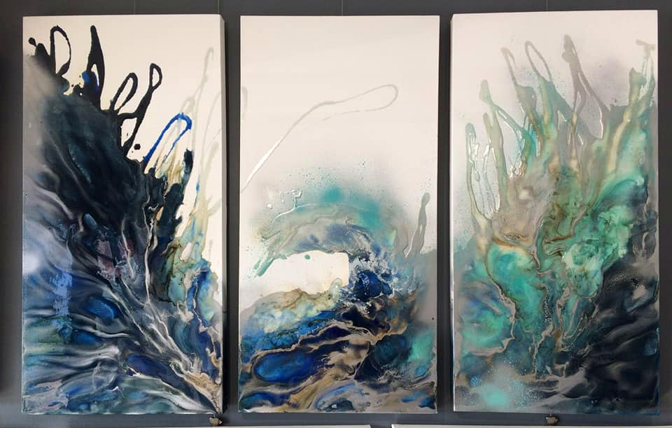 Ewaldi artwork: Three vertical oceanic fluid panels appear individually enclosed by dark surrounds; their blue.