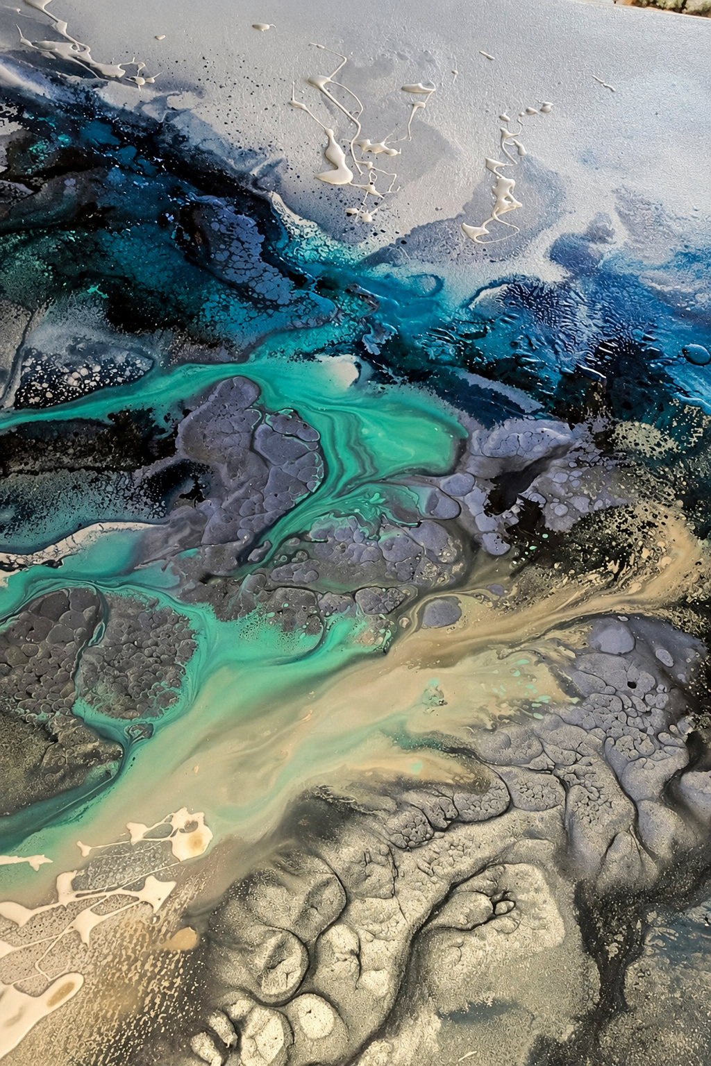 Ewaldi artwork: A diagonal teal-green fluid river cuts across dark grey ridges and pale golden marbling in a tall narrow.