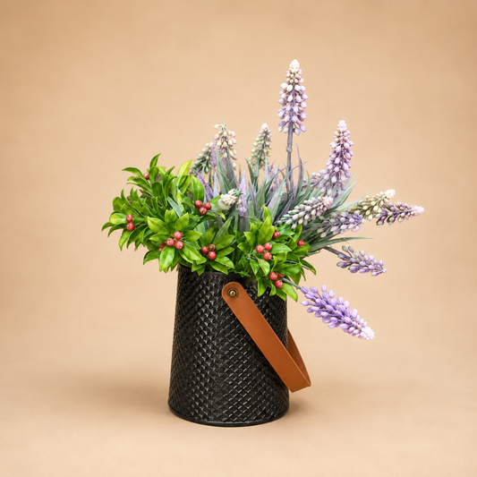 Faux Lavender Arrangement Black Vase photographed on a warm beige studio background