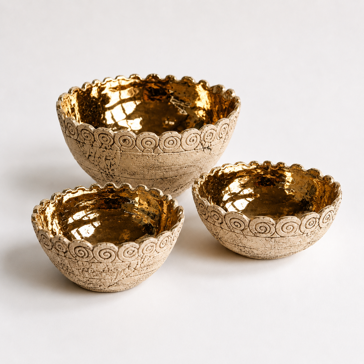 Gold Glazed Ceramic Bowls photographed on a warm beige studio background