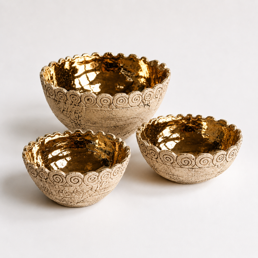 Gold Glazed Ceramic Bowls photographed on a warm beige studio background