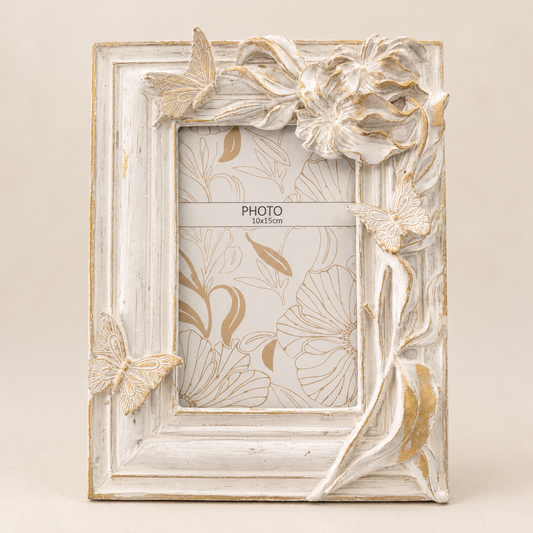 Ivory Floral Butterfly Photo Frame photographed on a warm beige studio background