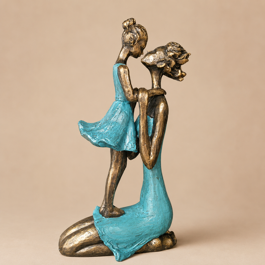 Turquoise Mother and Child Sculpture photographed on a warm beige studio background