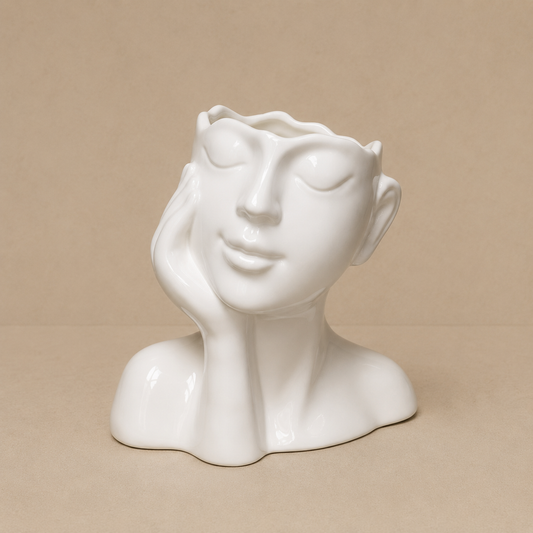 White Sculptural Face Vase photographed on a warm beige studio background